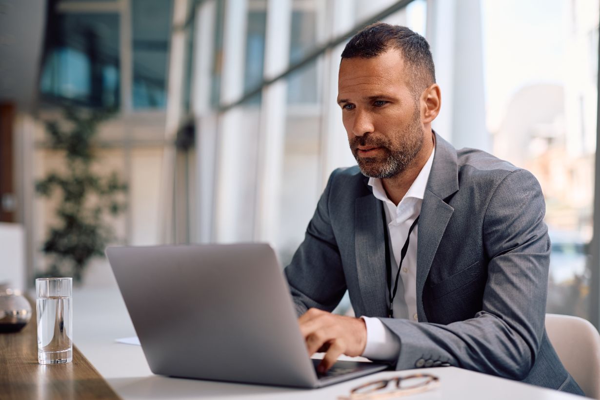Mid Adult Businessman Working On A Computer In The 2025 04 13 05 08 41 Utc 1